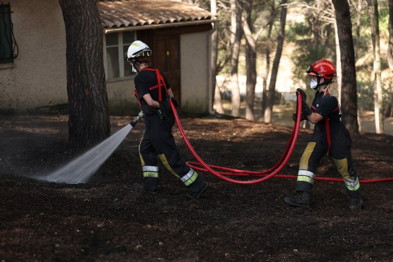 Hundreds of firefighters battle wildfire near Marseille amid improving conditions