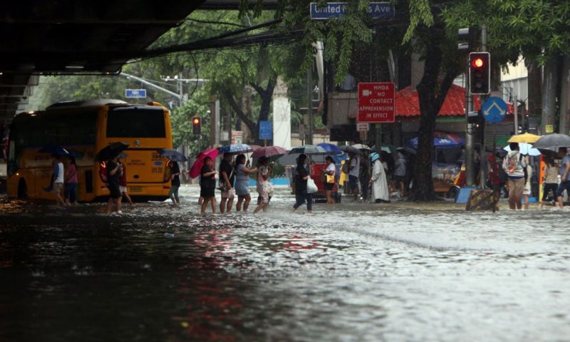 Floods in Philippines displace thousands as torrential rains continue