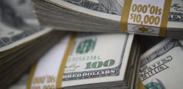 US dollar edges higher on trade optimism
