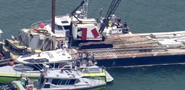 Two children die at Miami sailing camp in boat collision with barge