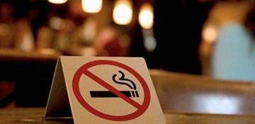 France bans smoking in most public areas