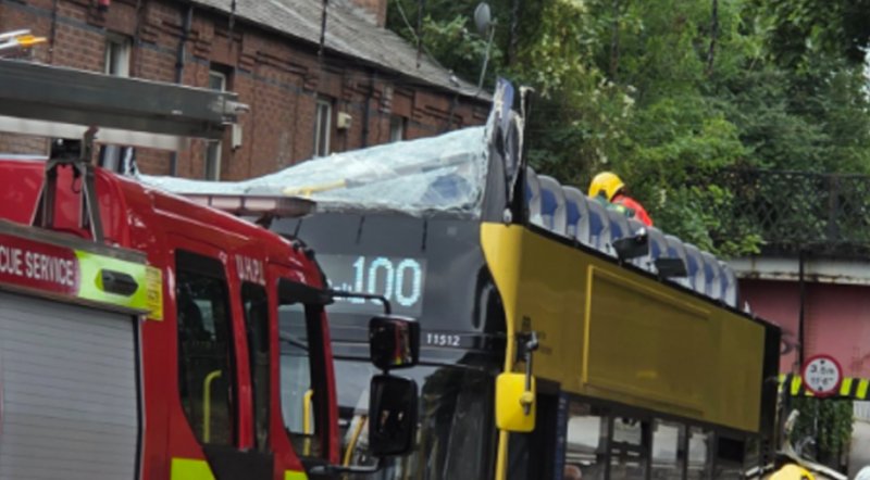 Bus driver arrested after 20 injured in Manchester double-decker crash