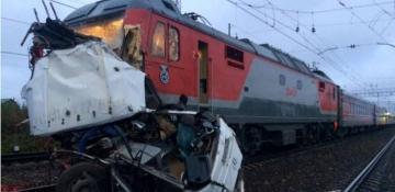 One dead, 11 injured after bus collides with freight train in Russia's Leningrad