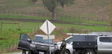 Australian police battle wintry weather in manhunt for heavily armed gunman