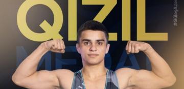 Azerbaijani wrestler beats Armenian rival to clinch world title