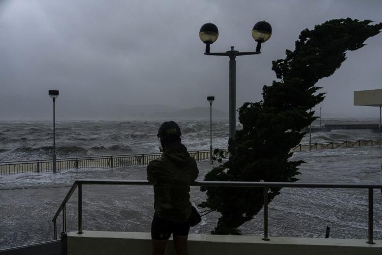 Hong Kong lowers typhoon alert as Ragasa edges away 