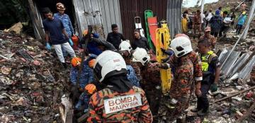 At least 13 dead as landslides hit Malaysia