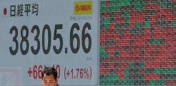 Asian stocks mixed after Fed cuts interest rates