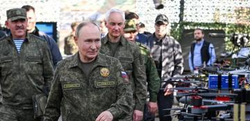 Putin inspects joint Russia-Belarus war games in military uniform