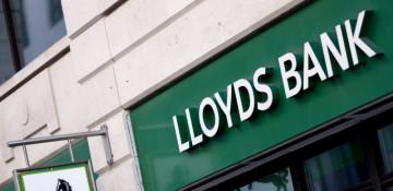 Lloyds profits tumble amid car loan scandal