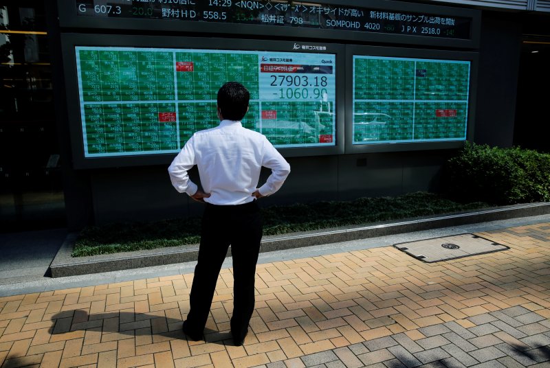Asian stocks tumble as Wall Street rout, Fed uncertainty rattle markets