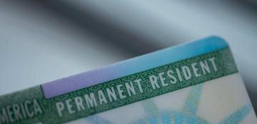 What is a residence permit and how does it differ from citizenship
