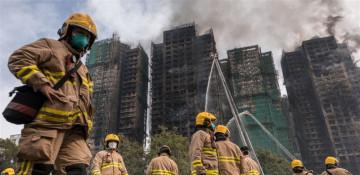 83 dead as Hong Kong firefighters battle burning towers for 2nd day