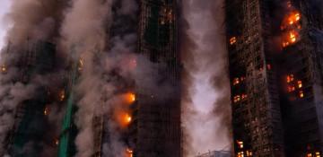 Hong Kong blaze death toll rises to 128, arrests expand