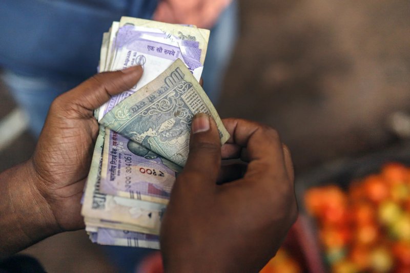 Indian rupee hits record low as trade talks with US stall