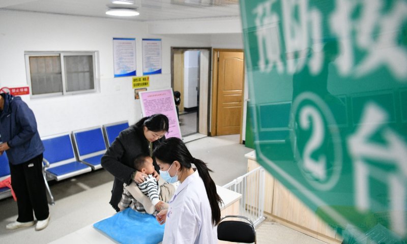 China battles rising flu cases, kids advised caution