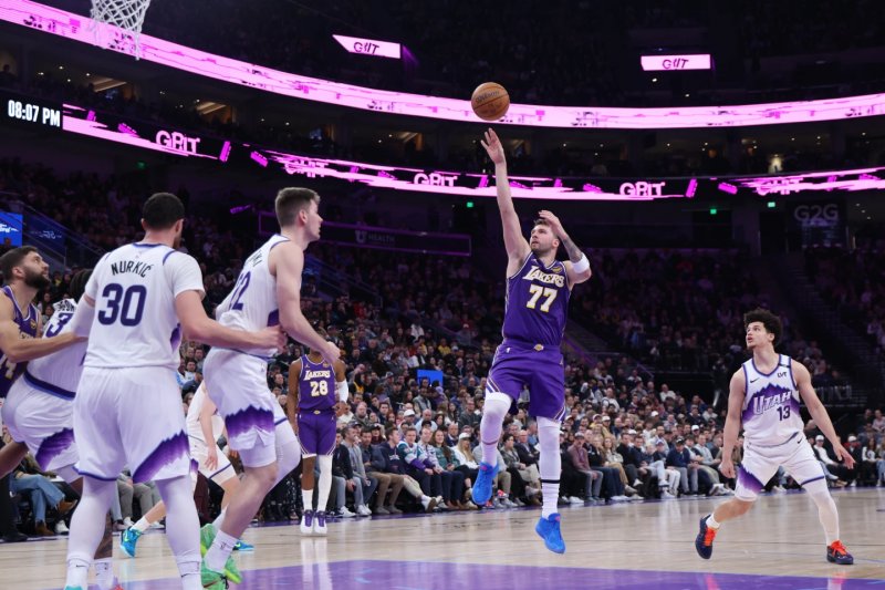 Doncic’s triple-double lifts Lakers past Jazz 143-135