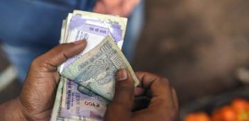 Indian rupee hits record low as trade talks with US stall