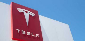 Tesla stock hits record highs