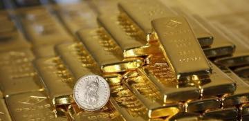 Gold prices tick down from record high