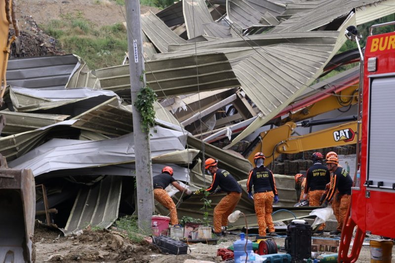 Dozens trapped or missing after landfill collapse in Philippines