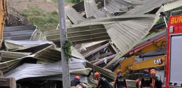 Dozens trapped or missing after landfill collapse in Philippines