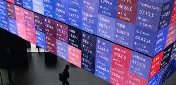 Tokyo stocks edge up as weak yen lifts exporters