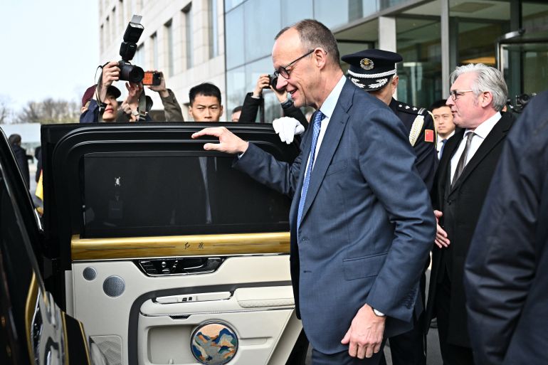 What was behind Merz visit to China