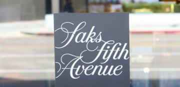 What is happening between Saks and Amazon
