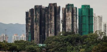 Hong Kong to buy homes destroyed in deadly high-rise fire 
