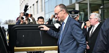 What was behind Merz visit to China