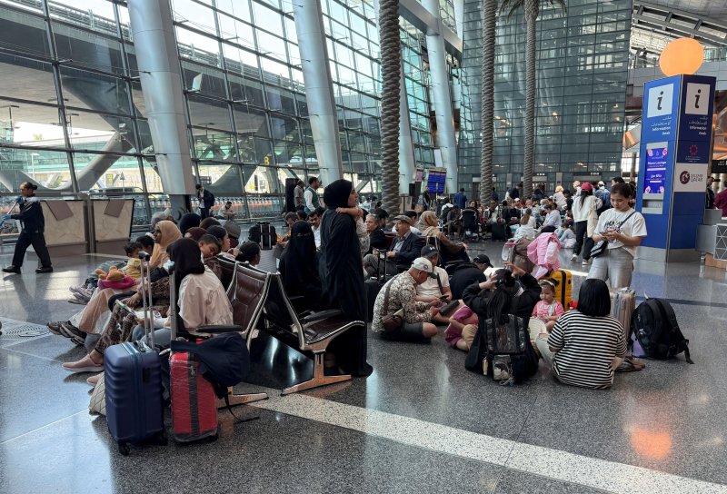 Qatar says almost 8,000 people stranded in transit