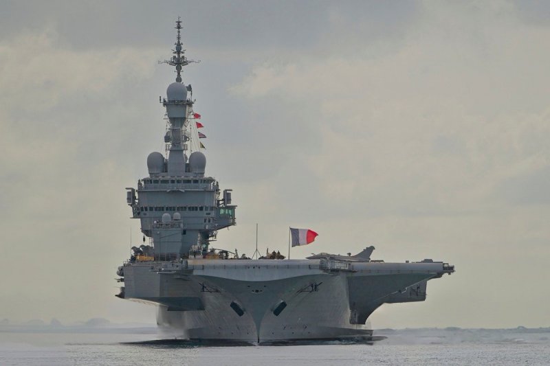 France sending aircraft carrier to Mediterranean, Macron says 