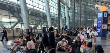 Qatar says almost 8,000 people stranded in transit