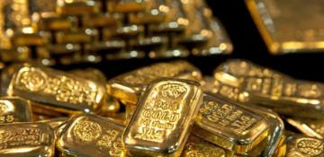 Gold drops amid stronger dollar and rate concerns