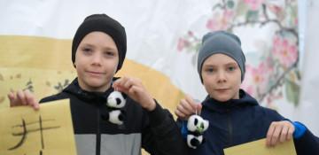 Why is the Chinese language becoming more influential in Kazakhstan?