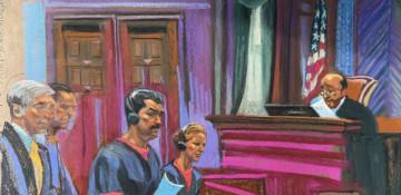 Maduro glances at wife as couple appear in court in jail uniforms