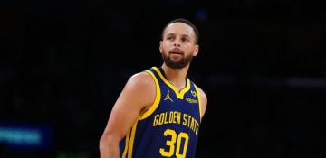 Warren Buffett, NBA star Stephen Curry team up for charity lunch