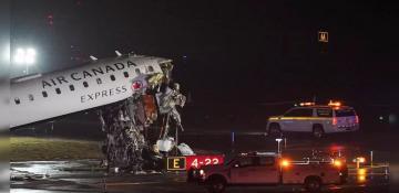 Two pilots killed as Air Canada Express jet collides with fire truck at LaGuardia 