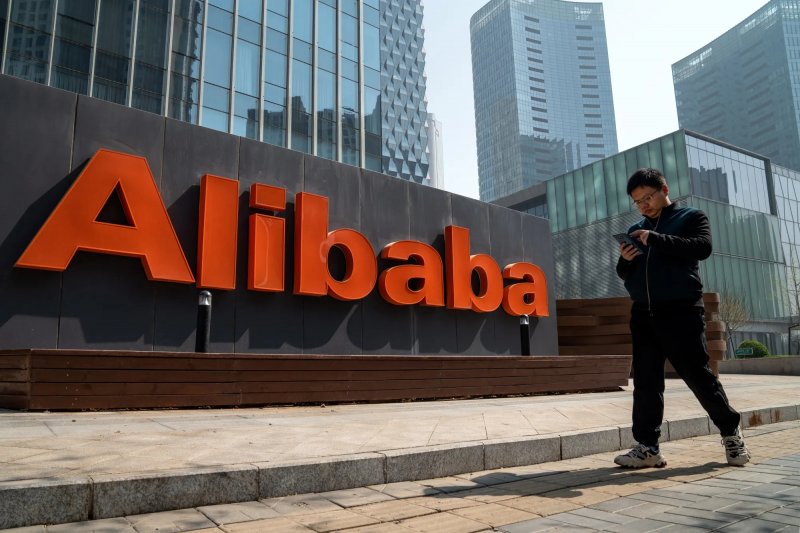 Alibaba shares edge higher in mixed market session