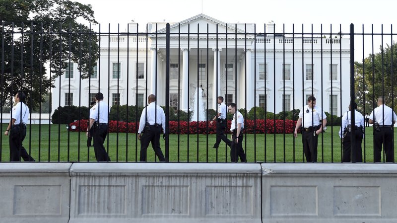 Man detained after scaling White House fence, officer injured