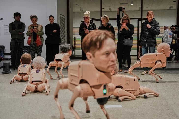 Robot dogs with Musk and Zuckerberg heads roam Berlin gallery in Beeple's new exhibit
