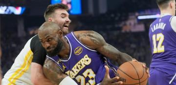 Lakers beat Warriors 119-103 as Curry sits out