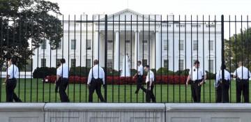 Man detained after scaling White House fence, officer injured