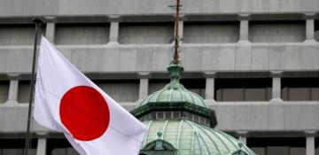 Bank of Japan holds rates, raises inflation outlook