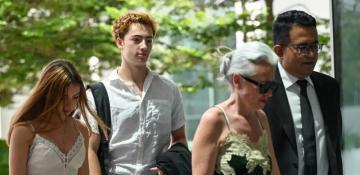 French teen charged in Singapore for licking juice machine straw