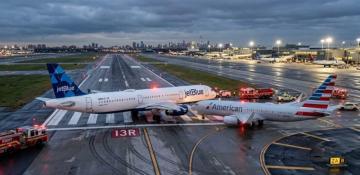 Close call at JFK: Two planes narrowly avoid collision after runway overshoot