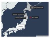 Japan revises earthquake up to magnitude 7.5