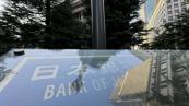 Bank of Japan holds rates steady, raises inflation forecast
