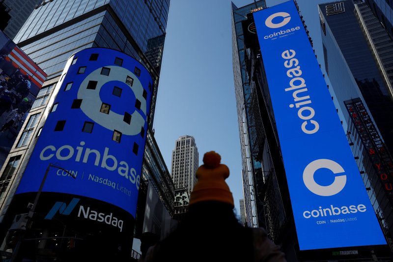 Coinbase shares advance despite layoff plan